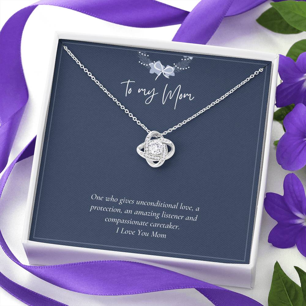 Love Knot Necklace - One Who Gives Unconditional Love | Jewelry | C30011TG, C30011TR, christmas gifts, daughter necklace, daughter necklace from dad, gift-for-mom, Gifts, gifts for christmas, Gifts for Mom, Love Knot Necklace, lx-C30011, mother daughter necklace, mother daughter necklace set, mother daughter necklaces, necklace, Necklace Gifts, Necklaces, necklaces gifts, PB23-WOOD, PROD-728786, PT-922, TNM-1, USER-43062, white gold love knot necklace, White Gold Necklace | TageUnlimited